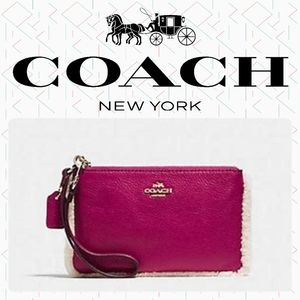 Coach pink shearling wristlet